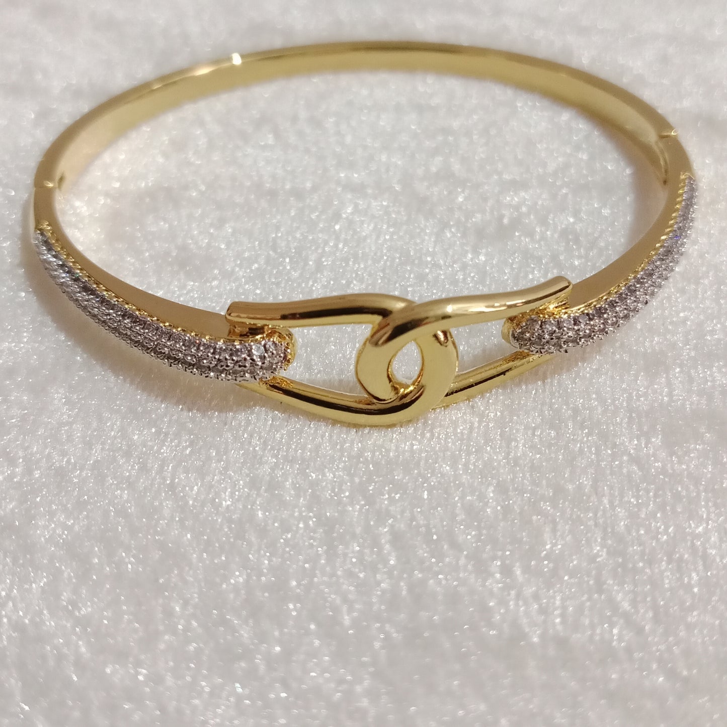 American Diamond Bracelet knot design close-up with gold polish – Blingso