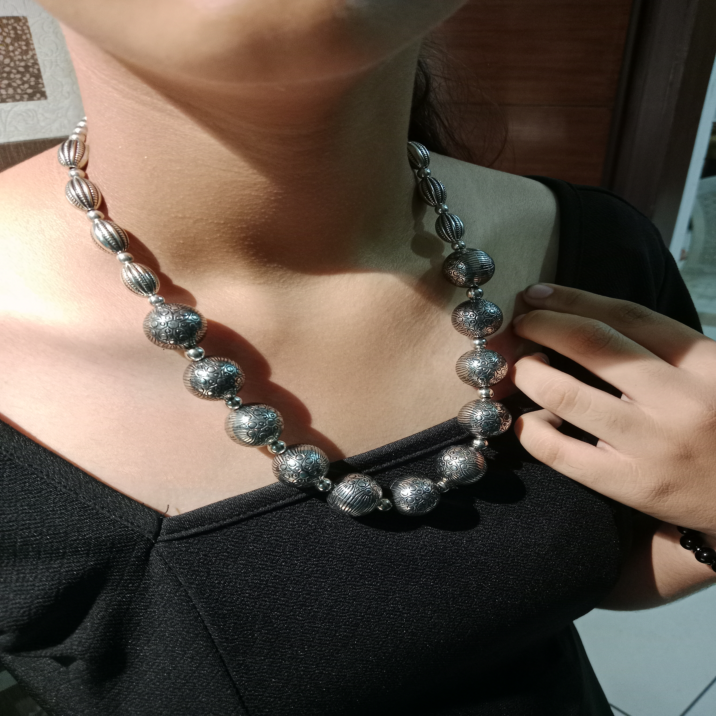 Woman wearing oxidized beaded necklace set with earrings – Blingso