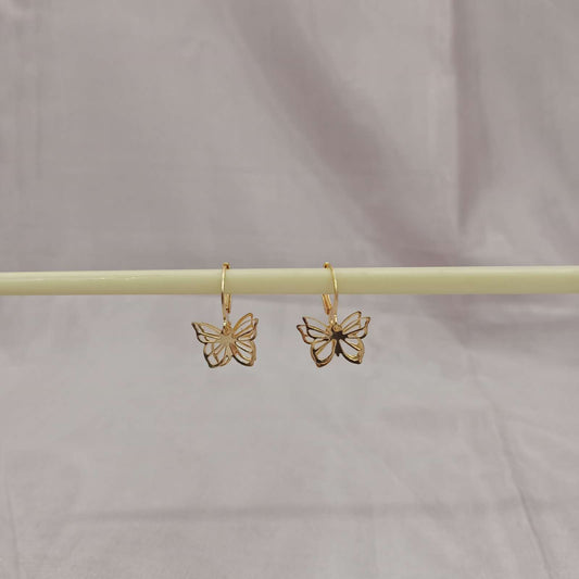 Golden Butterfly Cutout Earrings – side view on bar