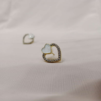 Minimal white heart stud earrings close-up – Blingso