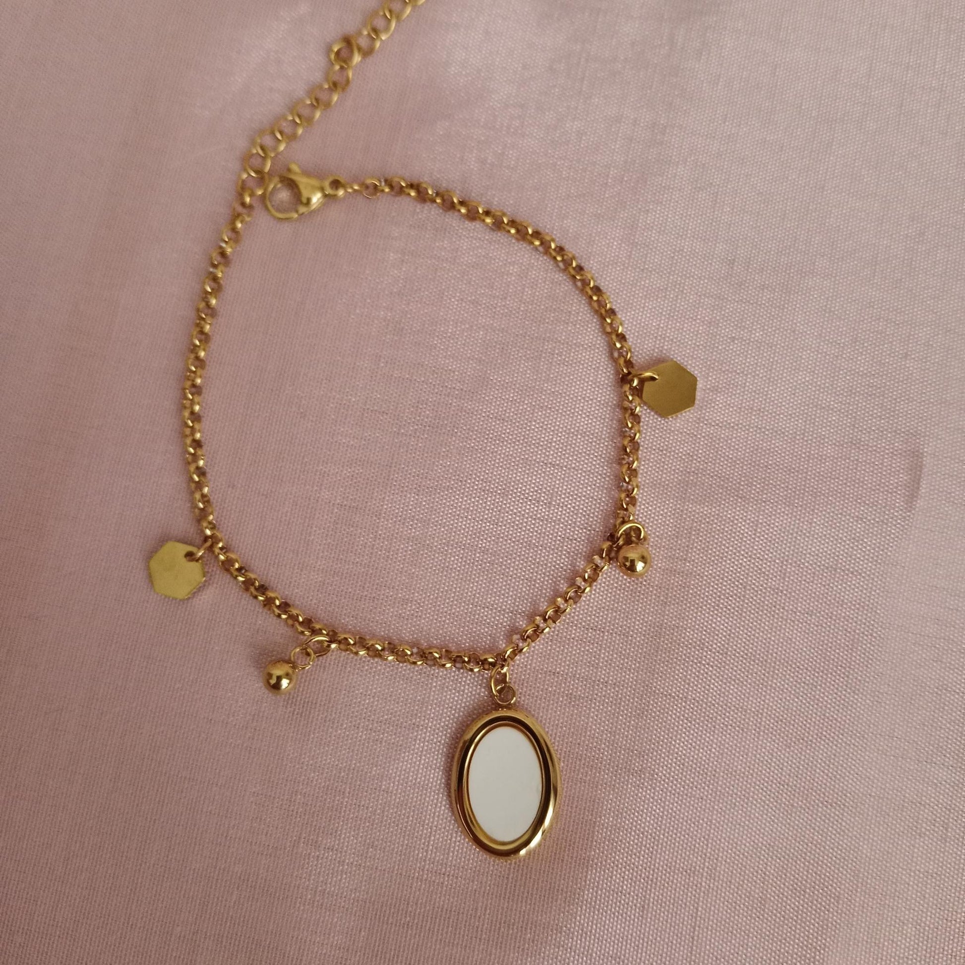 White Oval Charm Golden Chain Bracelet bracelet by Blingso