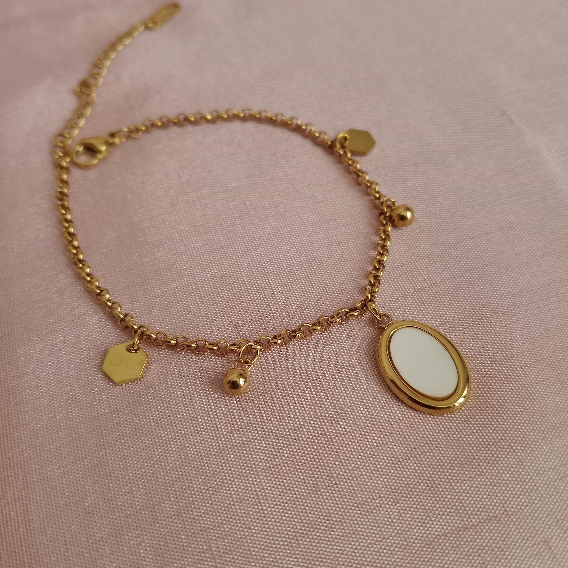 White Oval Charm Golden Chain Bracelet bracelet by Blingso