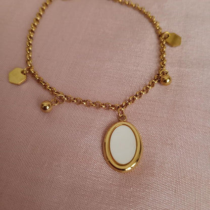 White Oval Charm Golden Chain Bracelet bracelet by Blingso