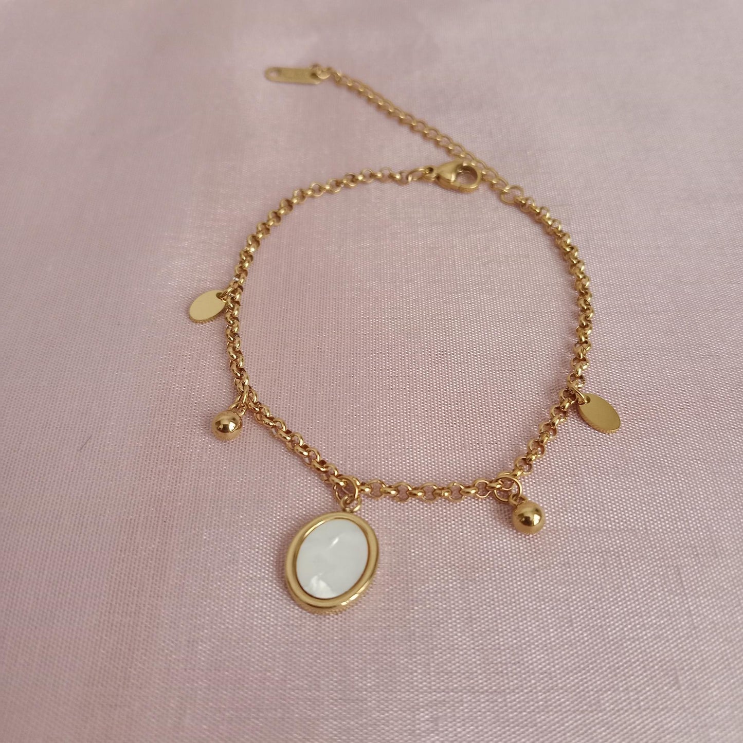 White Oval Charm Golden Chain Bracelet – front view
